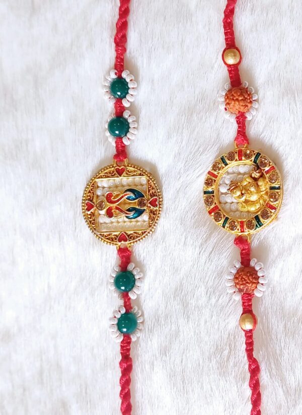 Couple Rakhi with Ganesha and Peacock design in Red and Green color - Image 3