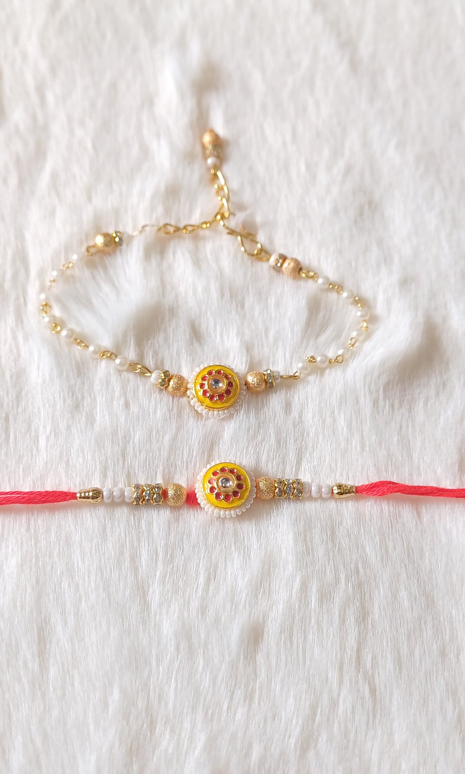 Couple Rakhi with White, Yellow and Red color with Flower Design