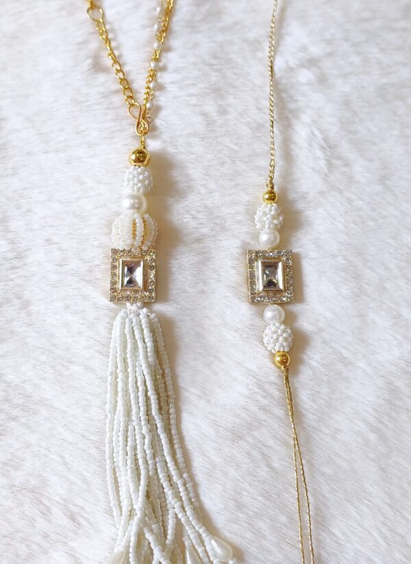 Couple Rakhi with White Pearls and Rectangle Pearl design