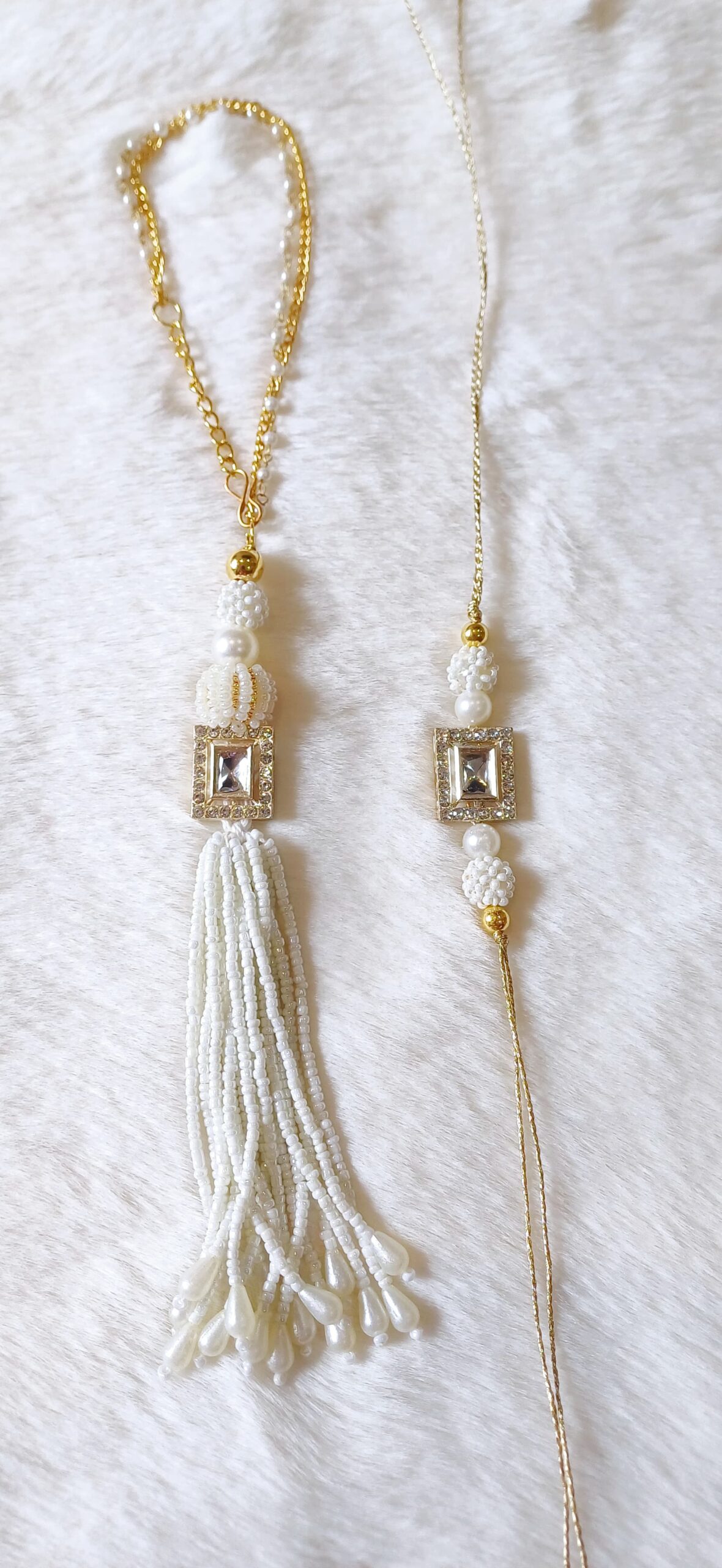 Couple Rakhi with White Pearls and Rectangle Pearl design