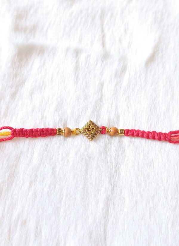 Pink color with Beads and Aum Rakhi