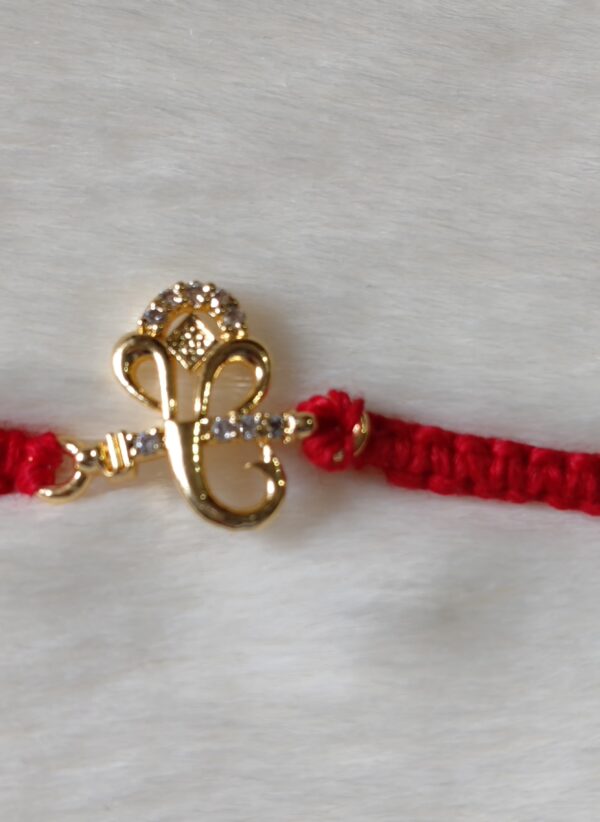 Red color with Golden Ganesh Design Rakhi