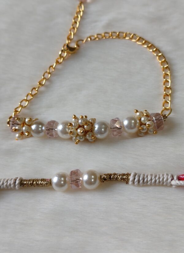 Couple Rakhi in Pink and Golden color with pearls in round design - Image 2