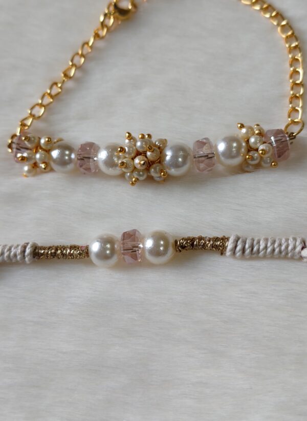 Couple Rakhi in Pink and Golden color with pearls in round design - Image 3
