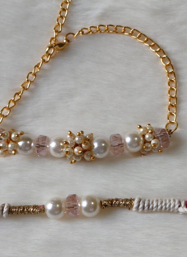Couple Rakhi in Pink and Golden color with pearls in round design - Image 4