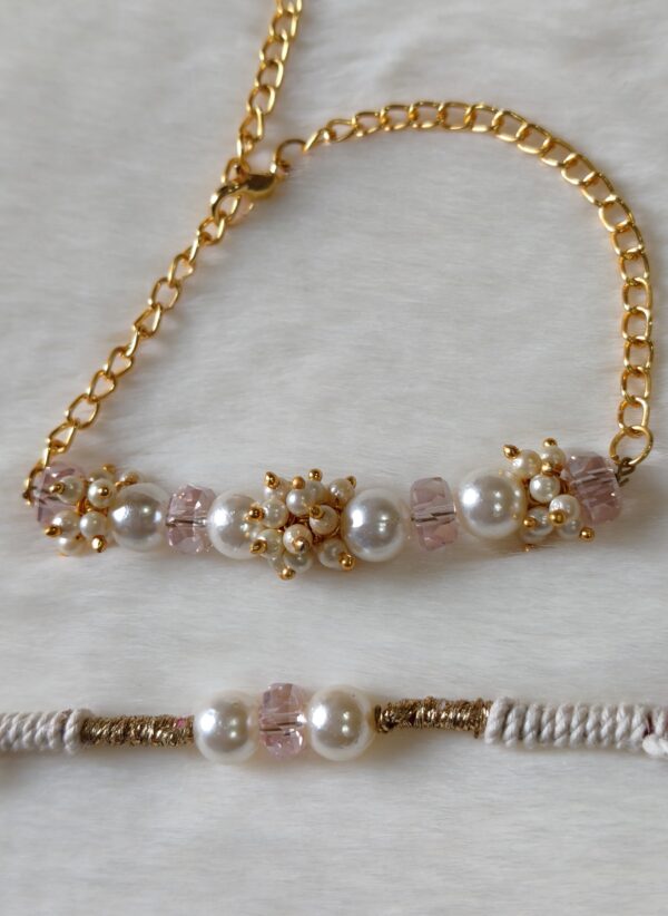 Couple Rakhi in Pink and Golden color with pearls in round design