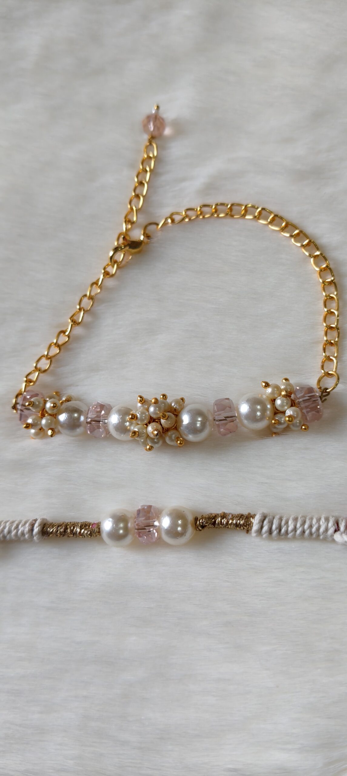 Couple Rakhi in Pink and Golden color with pearls in round design