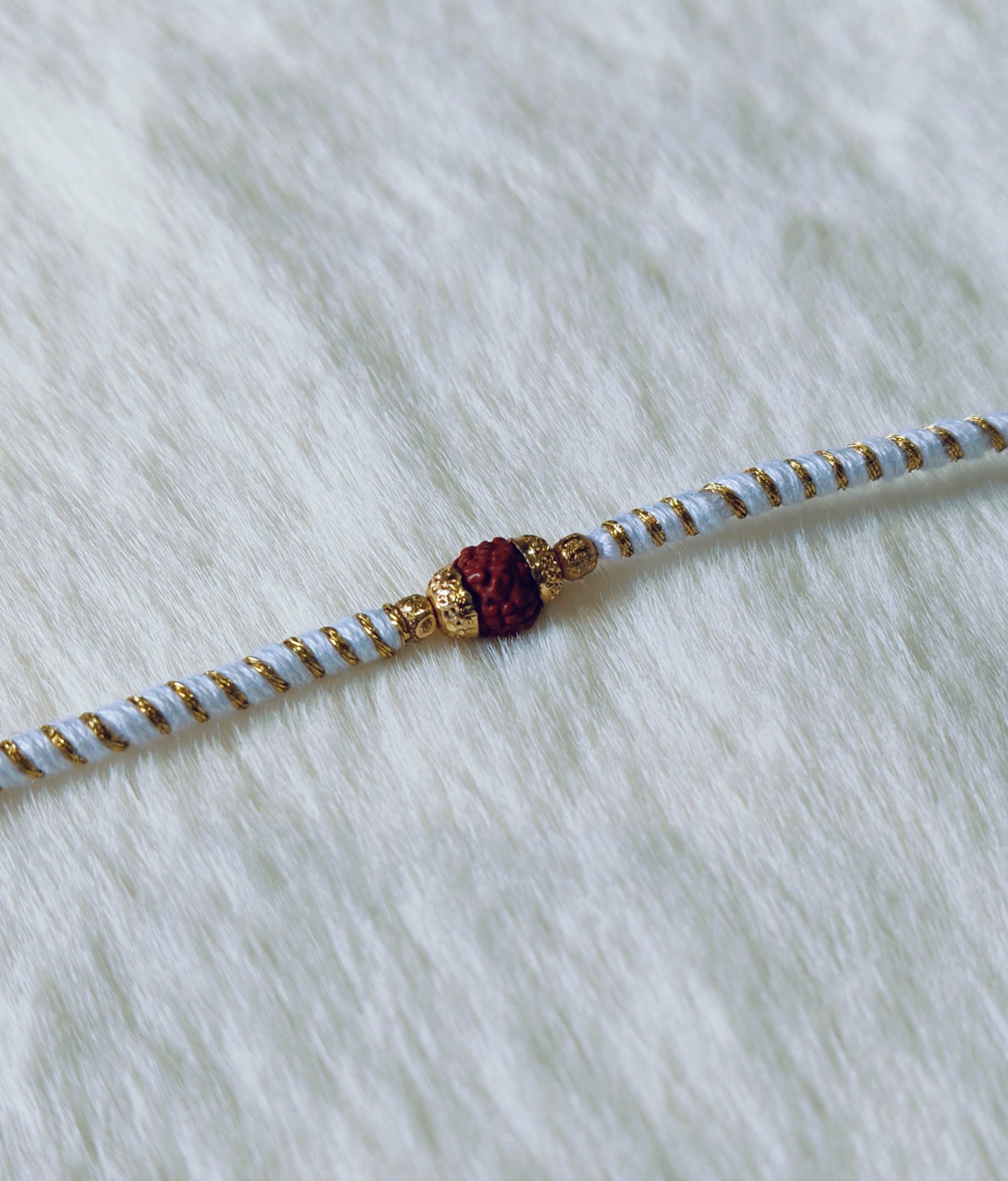 Light Blue and Golden color with Rudraksha Rakhi