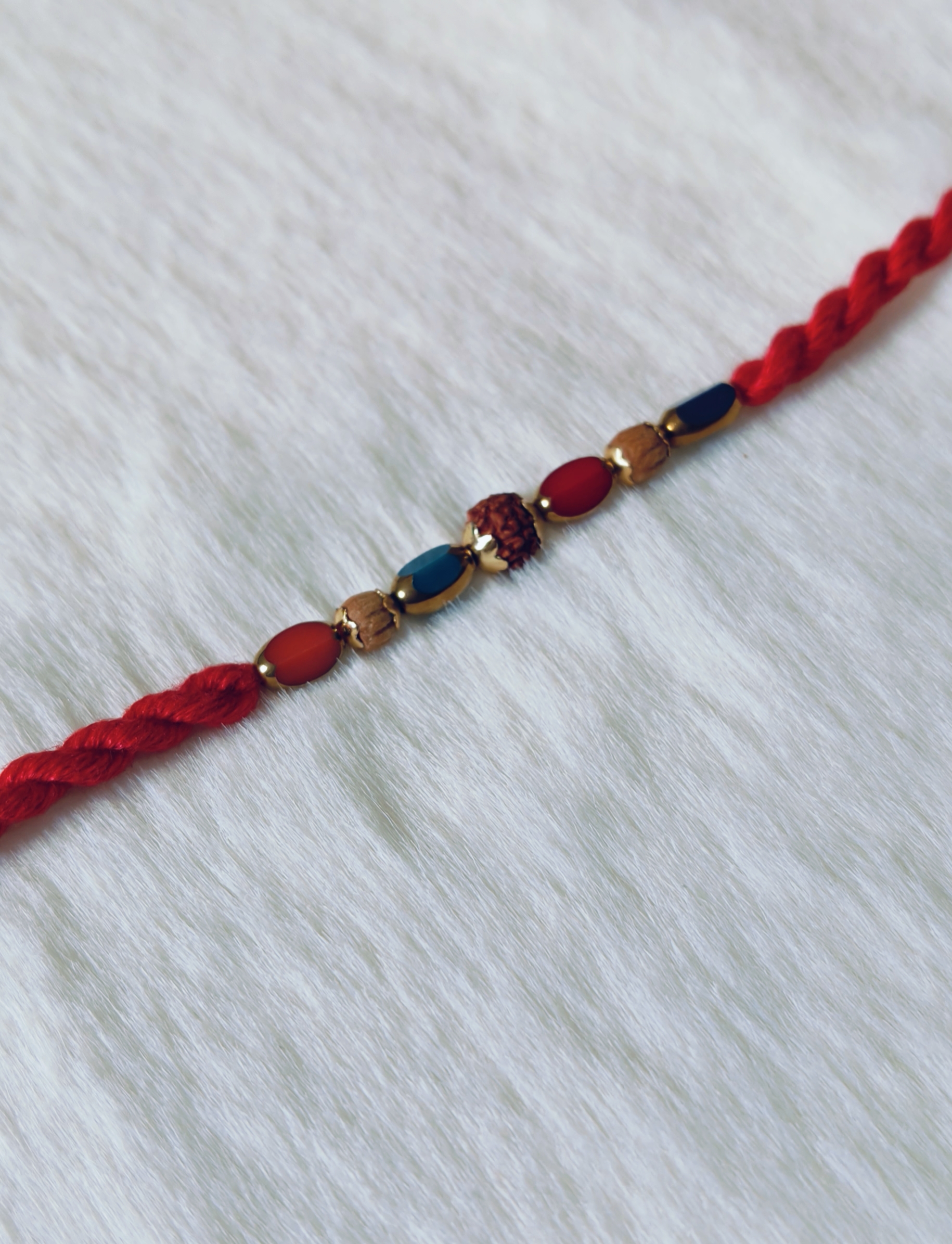 Red color with Rudraksha and Pearls in Blue and Red color