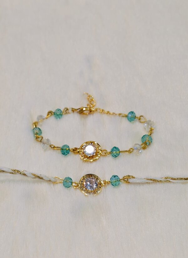 Couple Rakhi - Golden and Blue color with Maroon Circle shaped pearl