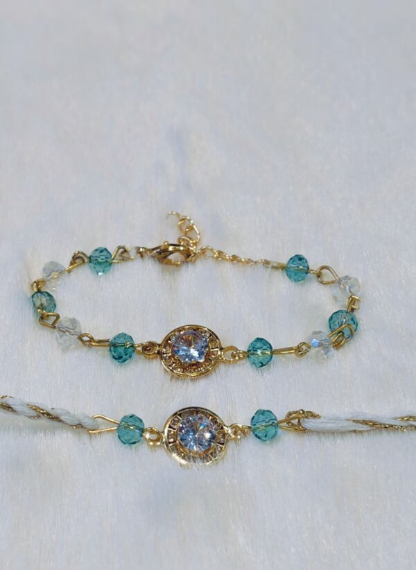 Couple Rakhi - Golden and Blue color with Maroon Circle shaped pearl - Image 5