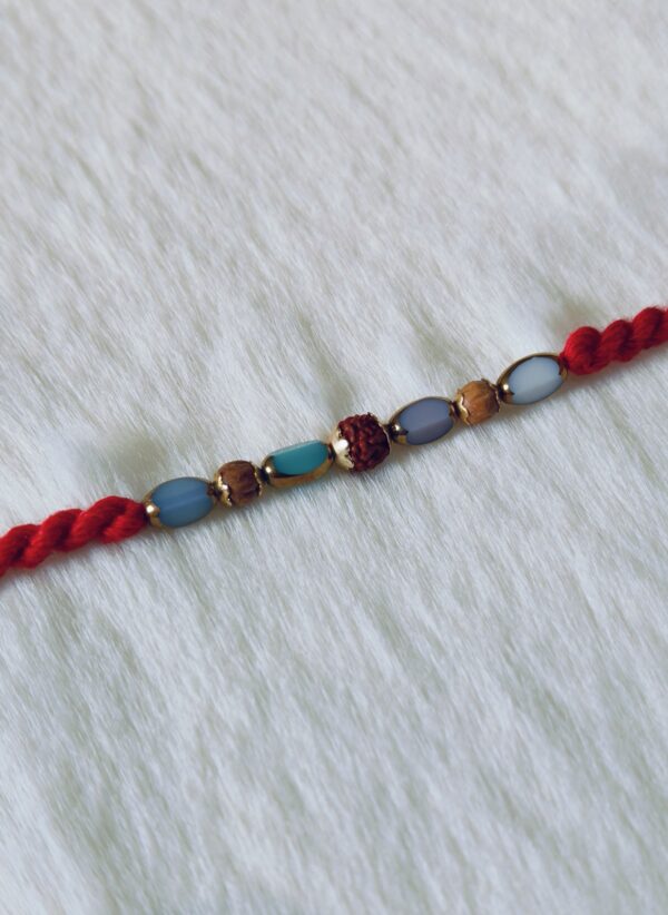 Red color with Rudraksha and Pearls in Blue and Light Blue color