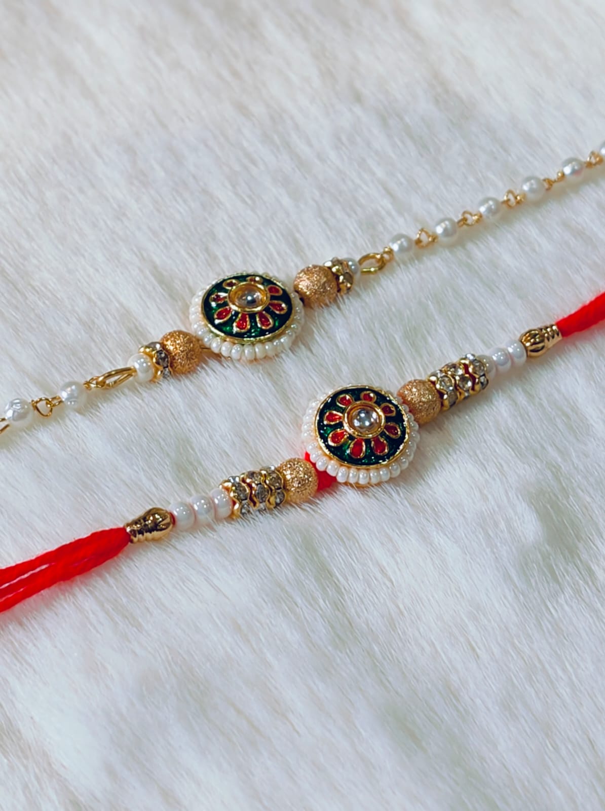 Couple Rakhi with White, Green and Red color with Flower Design with white background